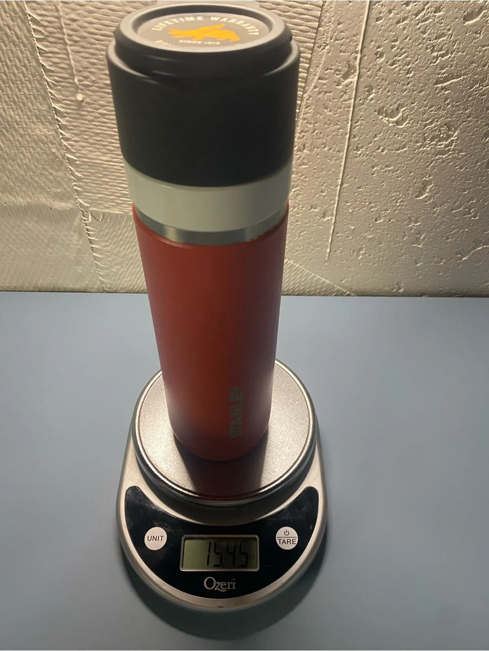 Stanley Orange Tumbler with Black Lid and White Band